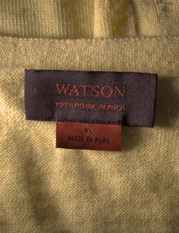Watson label on yellow sweater